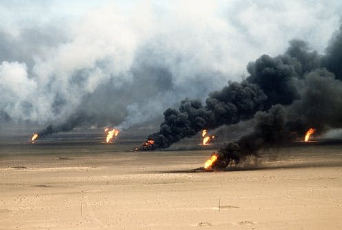 <span class="caption">Oil well fires burning outside of Kuwait.</span> <span class="attribution"><a class="link " href="https://www.shutterstock.com/image-photo/oil-well-fires-rage-outside-kuwait-244390672" rel="nofollow noopener" target="_blank" data-ylk="slk:Everett Collection/ Shutterstock;elm:context_link;itc:0;sec:content-canvas">Everett Collection/ Shutterstock</a></span>