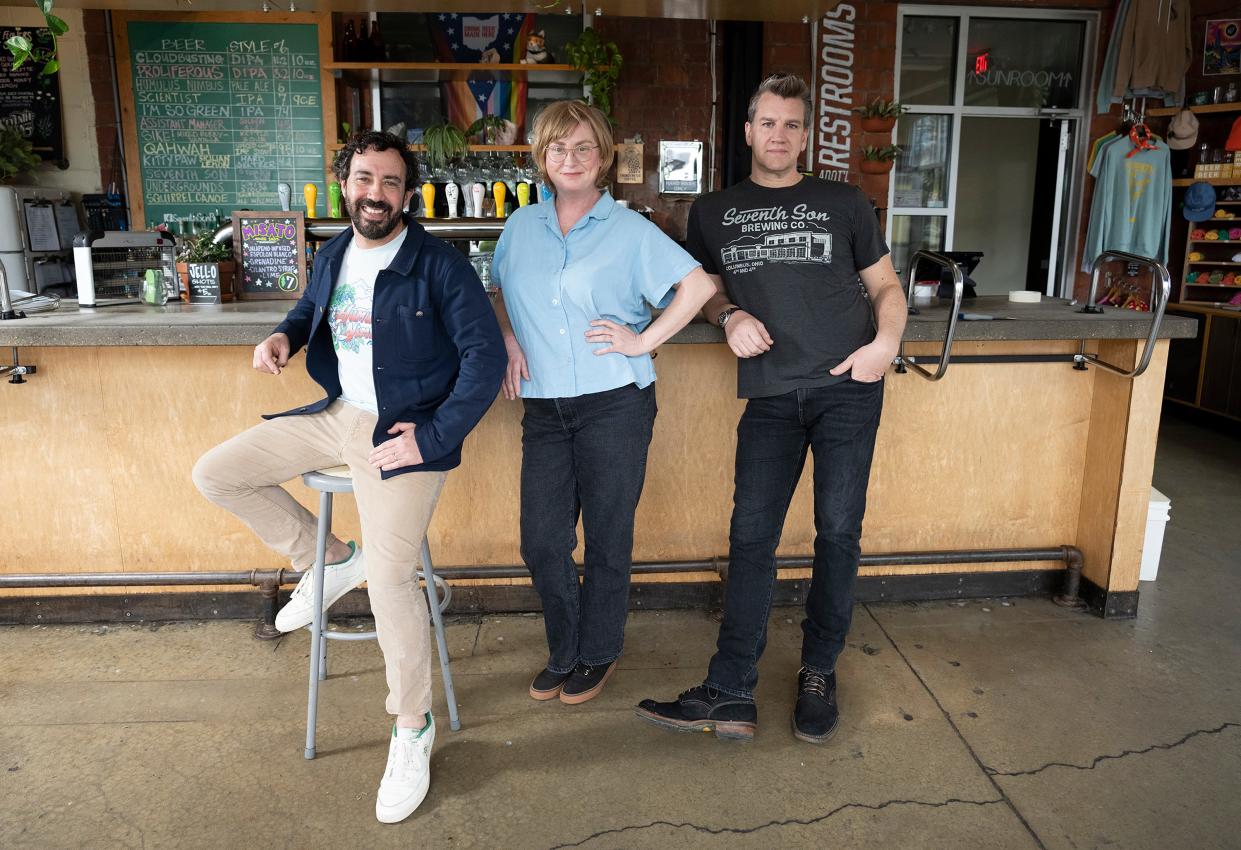 Left to right, Seventh Son Brewing Co. founders and childhood friends Collin Castore, Jen Burton and Travis Spencer in the downstairs bar area of the brewery, which is celebrating its 10th anniversary.