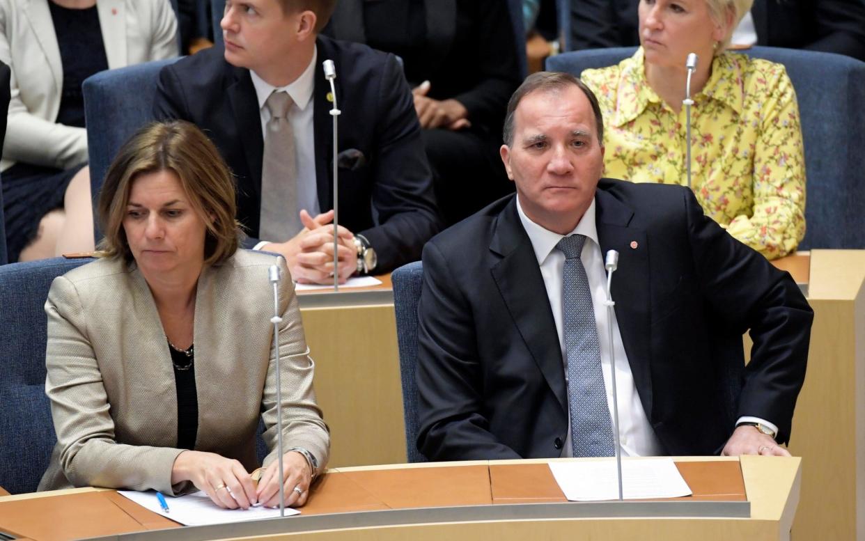 Out: reality bites for Swedish Prime Minister Stefan Lofven, right, during the vote of confidence in the Riksdagen - TT Scanpix
