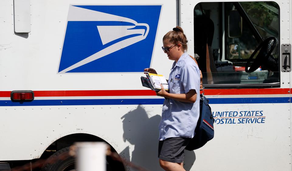 Thefts from mail carriers, like this one seen in Denver in July 2020, have increased nationwide in the past several months. Some of those incidents took place in South Florida, the U.S. Postal Inspection Service said.