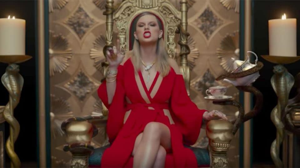 Swifty sitting on her throne. See the snakes! Source: Big Machine Records