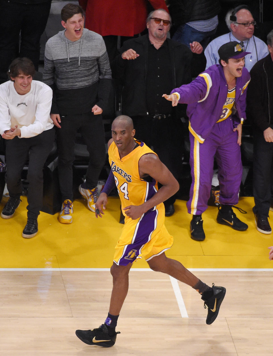 Actor Jack Nicholson, top center, cheers long with his son Ray, right, after Los Angeles Lakers forward Kobe Bryant, below, made a basket during the second half of an NBA basketball game against the Utah Jazz, Wednesday, April 13, 2016, in Los Angeles. (AP Photo/Mark J. Terrill)