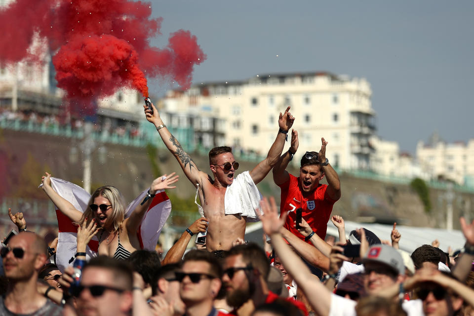 Football fans watch England take on Sweden in The World Cup Quarter Finals at Luna Beach Cinema on Brighton Beach on July 7, 2018 in London, England. (Getty Images)