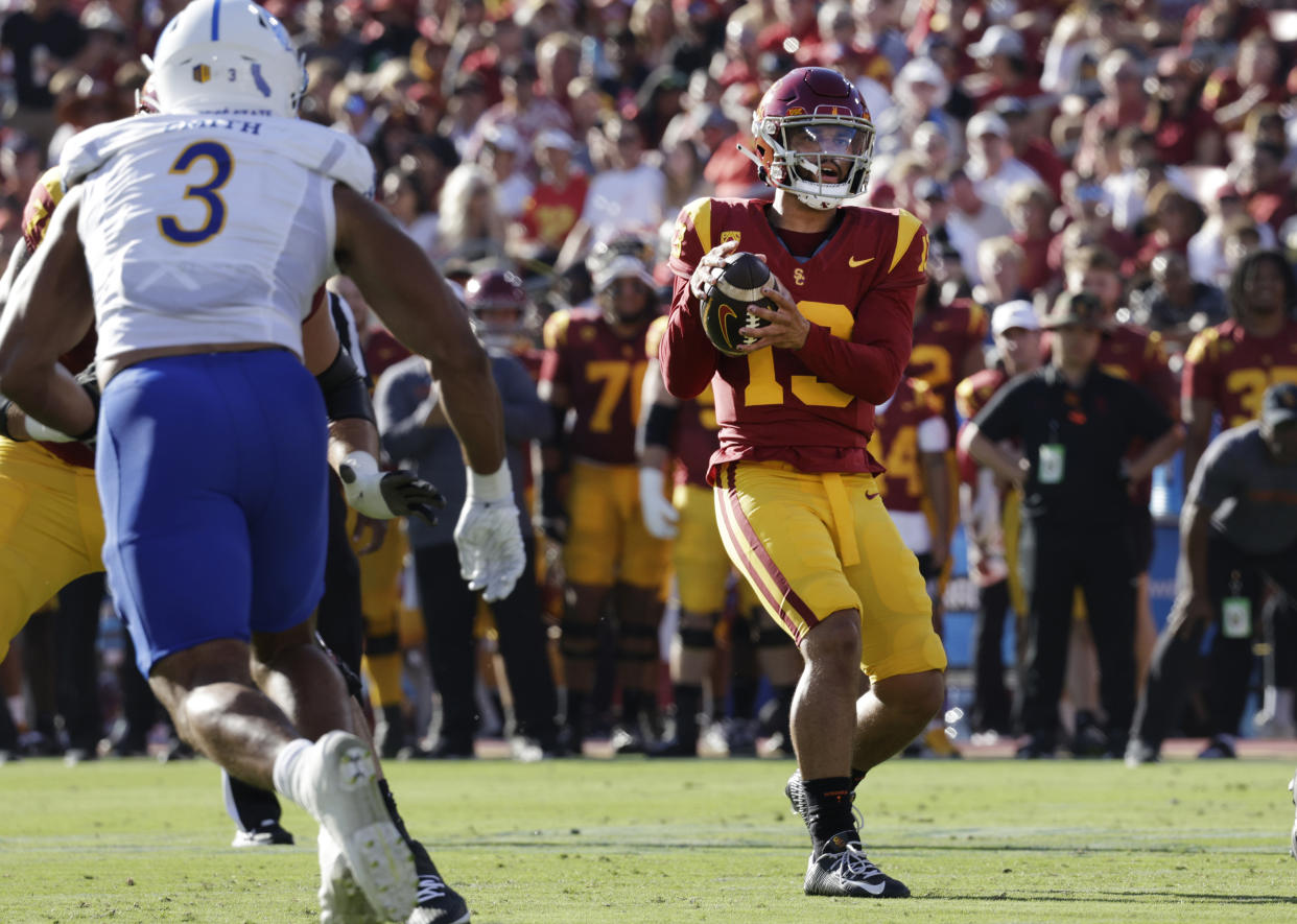 LOS ANGELES, CA - AUGUST 26: USC quarterback Caleb Williams looks for wide receiver Dorian Singer for a 13-yard touchdown pass play in the first quarter against San Jose State during the season opener at the Los Angeles Memorial Coliseum in Los Angeles, CA on Saturday, Aug. 26, 2023. (Myung J. Chun / Los Angeles Times via Getty Images)