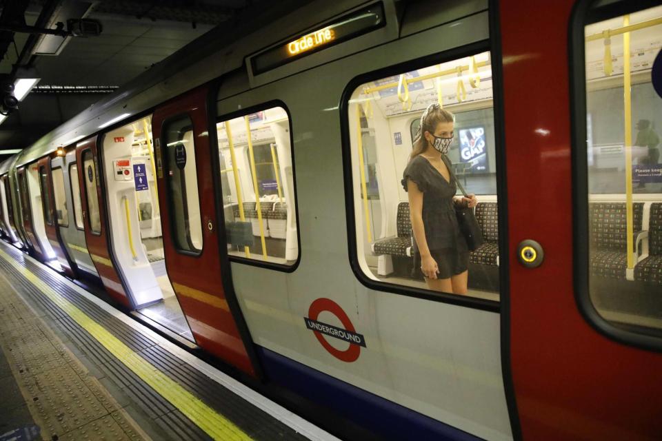 A woman wearing a mask on the Tube (AFP via Getty Images)