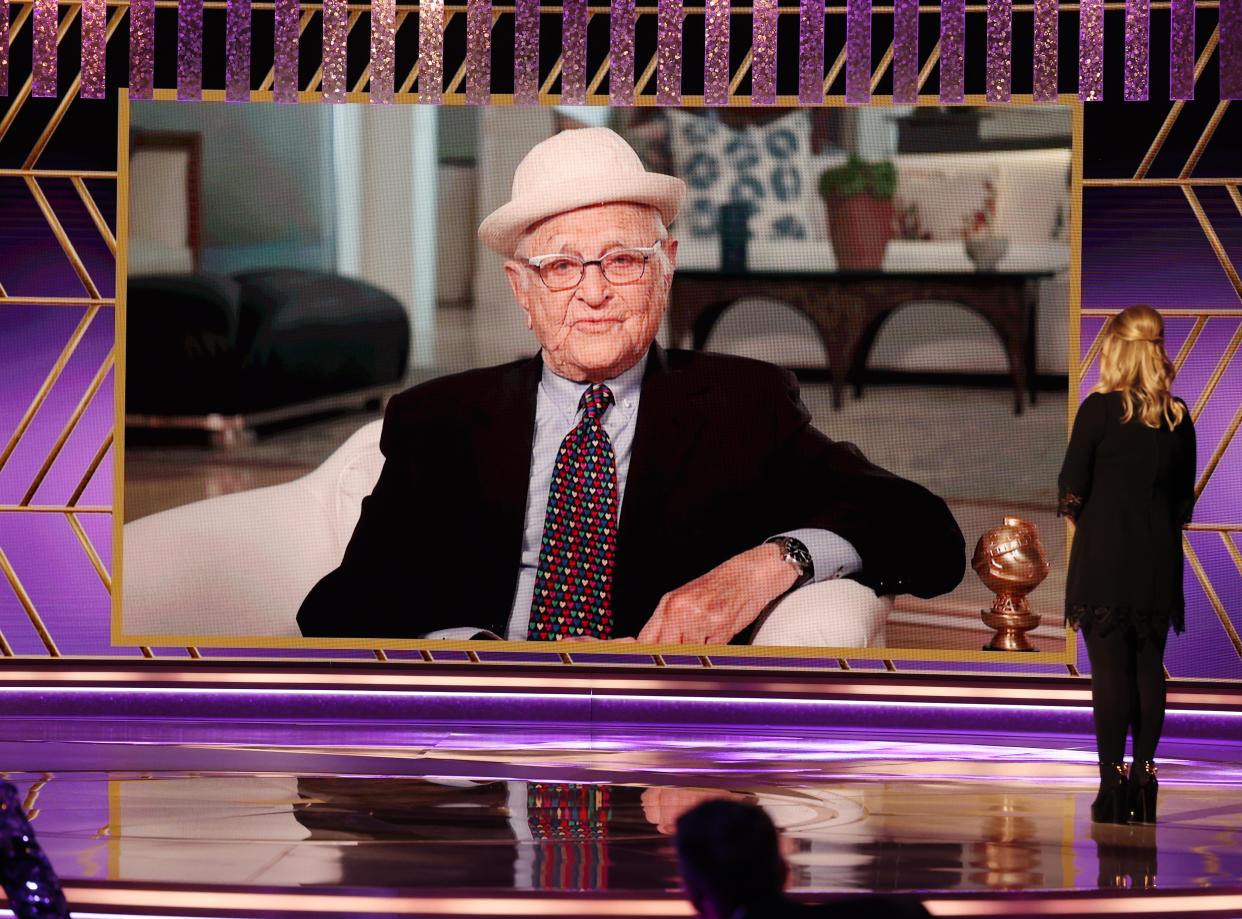 BEVERLY HILLS, CALIFORNIA: 78th Annual GOLDEN GLOBE AWARDS -- Pictured: (l-r) Honoree Norman Lear accepts the Carol Burnett Award while co-host Amy Poehler watches onstage at the 78th Annual Golden Globe Awards held at The Beverly Hilton and broadcast on February 28, 2021 in Beverly Hills, California. -- (Photo by Christopher Polk/NBC/NBCU Photo Bank via Getty Images)