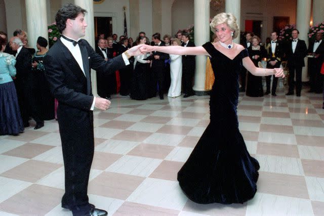 Shutterstock Princess Diana dances with John Travolta at a White House dinner in 1985