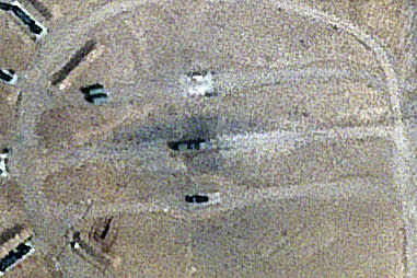 Burn marks surround what analysts identify as a radar system for a Russian-made S-300 missile battery, center, near an international airport and air base is seen in Isfahan, Iran, Monday, April 22, 2024. Satellite photos taken Monday suggest an apparent Israeli retaliatory strike targeting Iran's central city of Isfahan hit a radar system for a Russian-made air defense battery, contradicting repeated denials by officials in Tehran in the time since the assault. (Planet Labs PBC via AP)