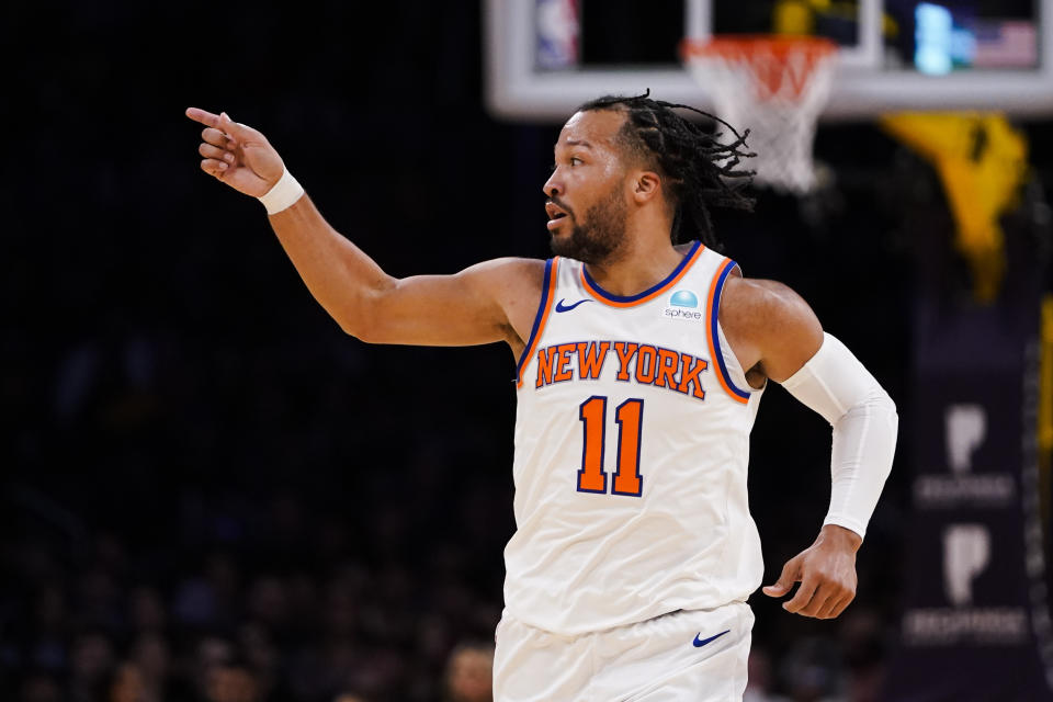 New York Knicks guard Jalen Brunson gestures during the first half of an NBA basketball game against the Los Angeles Lakers, Monday, Dec. 18, 2023, in Los Angeles. (AP Photo/Ryan Sun)