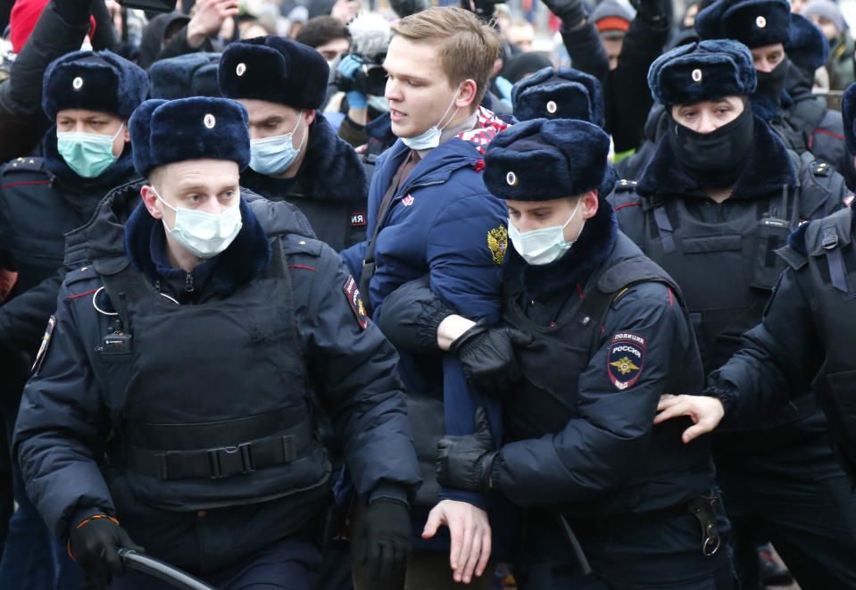 Police detain a man during a protest against the jailing of opposition leader Alexei Navalny in Moscow, Russia, Saturday, Jan. 23, 2021. Russian police are arresting protesters demanding the release of the top Russian opposition leader at demonstrations (AP Photo/Alexander Zemlianichenko)