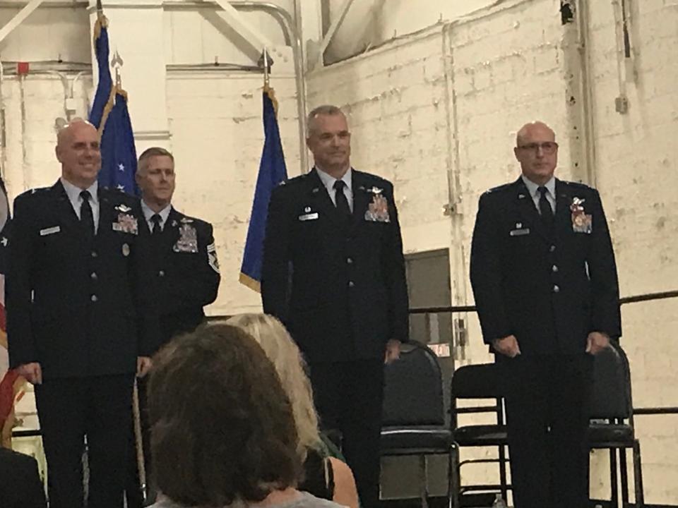 Brig Gen Gary McCue, at left, stands front row with Col. Darren Hamilton and Col. Todd Thomas Friday during the change of command ceremony at the 179th Airlift Wing of the Ohio Air National Guard at Mansfield Lahm Airport.