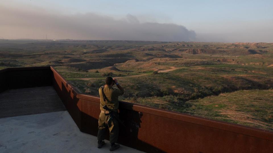 PHOTO: An Israeli soldier looks towards Gaza, amid the ongoing conflict between Israel and the Palestinian Islamist group Hamas, near the Israel-Gaza border, in southern Israel, Dec. 18, 2023.  (Ronen Zvulun/Reuters)