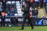 Britain Football Soccer - Swansea City v Middlesbrough - Premier League - Liberty Stadium - 2/4/17 Swansea City manager Paul Clement applauds fans after the match Reuters / Rebecca Naden Livepic