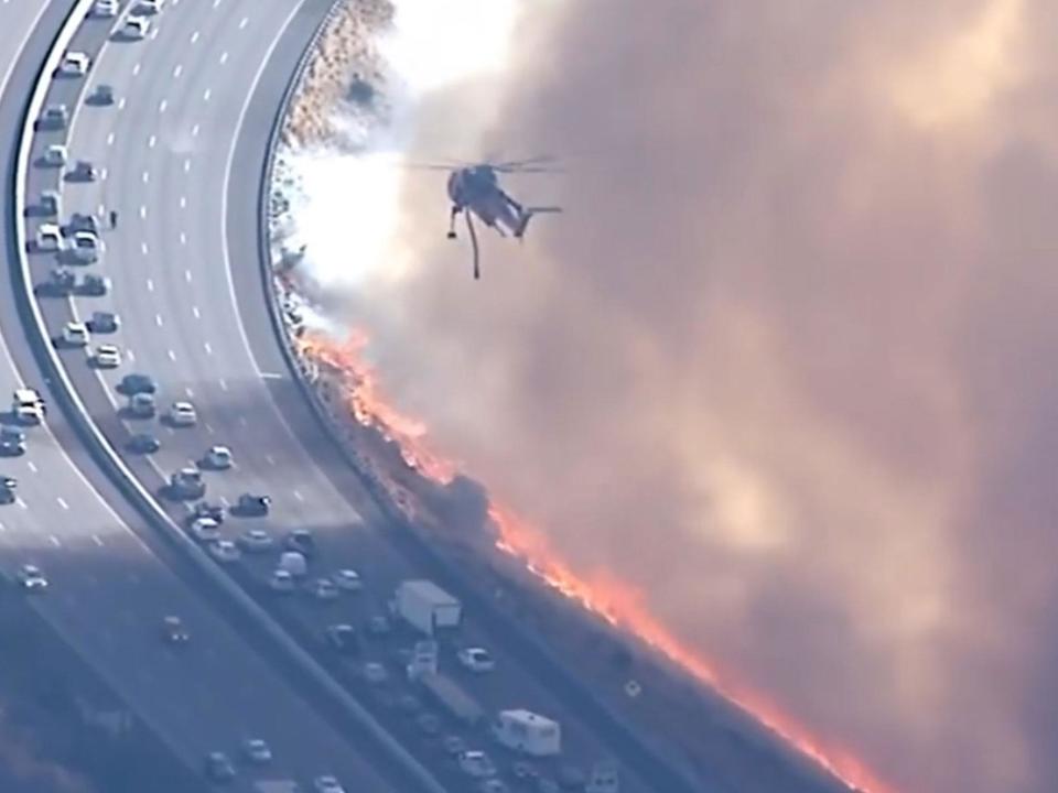 California wildfires: Cars come within metres of blaze on Los Angeles freeway