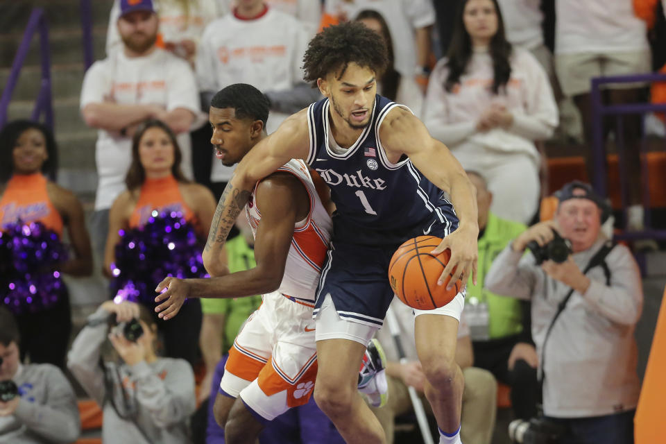 Duke center Dereck Lively II (1) grabs a defensive rebound over Clemson guard Joshua Beadle (0) during the first half of an NCAA college basketball game in Clemson, S.C., Saturday, Jan. 14, 2023. (AP Photo/Artie Walker Jr.)