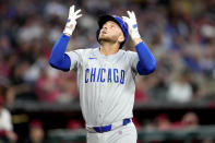 Chicago Cubs' Michael Busch crosses the plate after hitting a solo home run against the Arizona Diamondbacks during the second inning of a baseball game, Monday, April 15, 2024, in Phoenix. (AP Photo/Matt York)