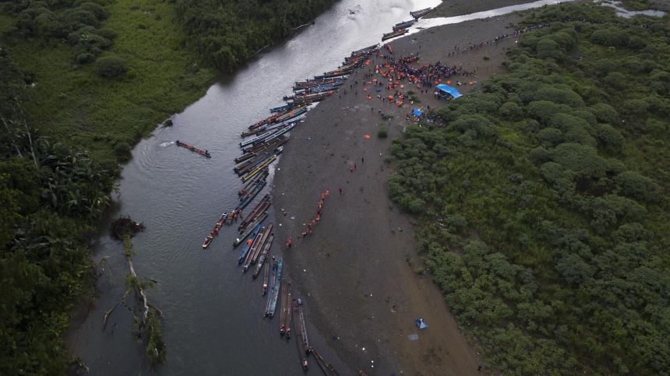 Migrants heading north take boats in Bajo Chiquito in the Darien province of Panama, Thursday, Oct. 5, 2023, after walking across the Darien Gap from Colombia. (AP Photo/Arnulfo Franco)