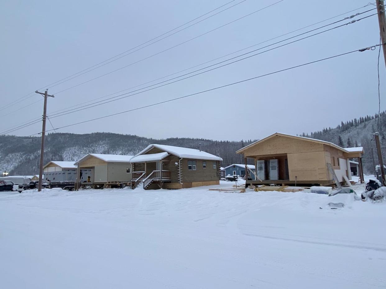 Four new single-family homes are currently under construction in the Trʼondëk Hwëchʼin subdivision of C-4 in Dawson City.  (Chris MacIntyre/CBC - image credit)