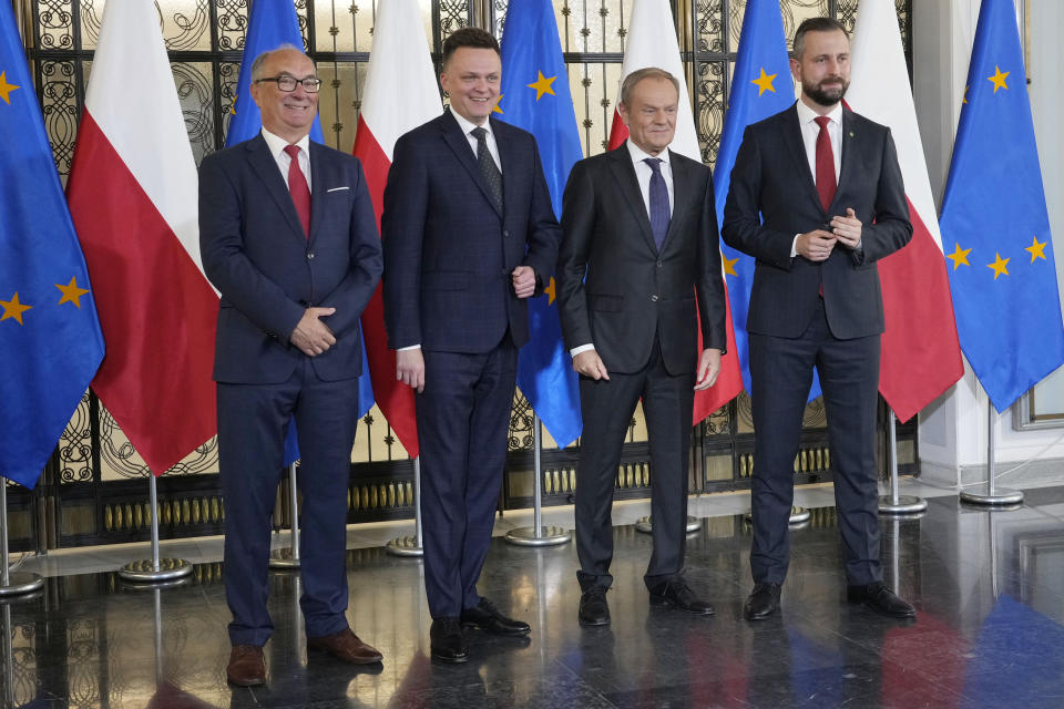 Opposition party leaders, from left, Wlodzimierz Czarzasty, Szymon Holownia, Donald Tusk and Władyslaw Kosiniak-Kamysz announce to reporters that Tusk is their candidate for prime minister and that they are ready to govern together, in Warsaw, Poland, on Tuesday Oct. 24, 2023. The parties together won a majority of seats in parliament in an election on Oct. 15. The current conservative nationalist ruling party, Law and Justice, won more votes than any other party but has no coalition partner and no apparent path to keeping power. (AP Photo/Czarek Sokolowski)