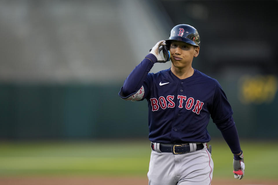 Boston Red Sox's Masataka Yoshida walks to the dugout after flying out against the Oakland Athletics during the third inning of a baseball game Monday, July 17, 2023, in Oakland, Calif. (AP Photo/Godofredo A. Vásquez)