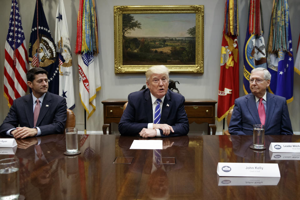 House Speaker Paul Ryan, R-Wis., left, and Senate Majority Leader Mitch McConnell, R-Ky., right, listen as President Trump speaks during a meeting with congressional leaders and administration officials on tax reform at the White House Sept. 5. (Photo: Evan Vucci/AP)