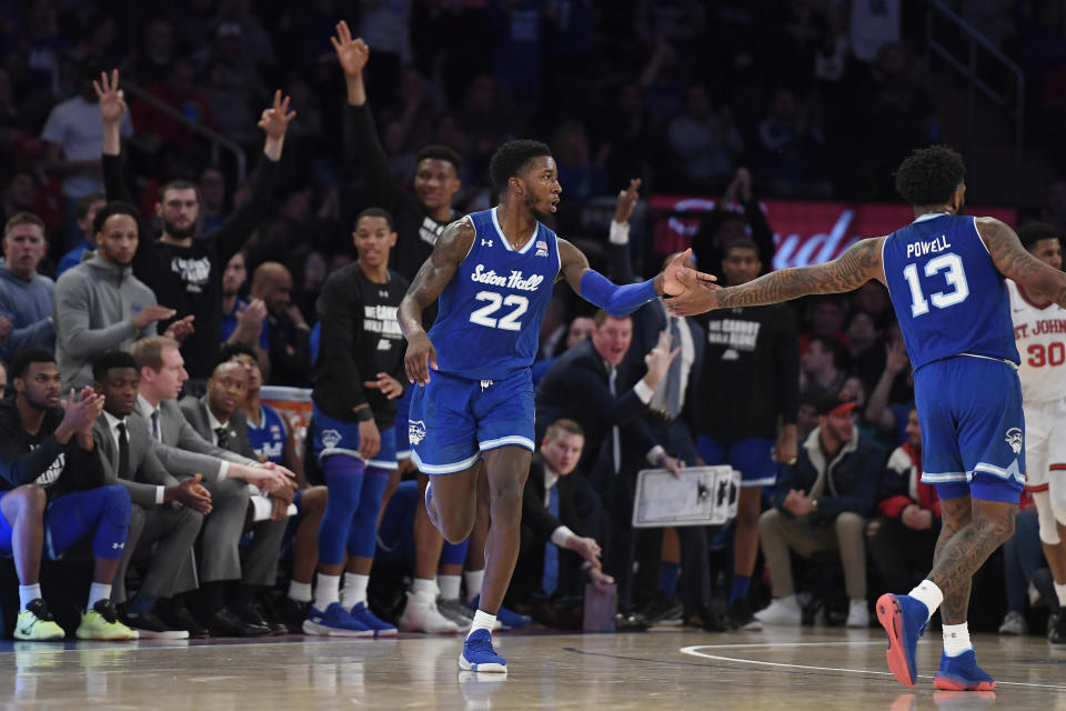 Seton Hall guard Myles Cale (22) high-fives guard Myles Powell (13) after Cale made a 3-point basket during the second half of an NCAA college basketball game against Seton Hall in New York, Saturday, Jan. 18, 2020. Seton Hall won 82-79. (AP Photo/Sarah Stier)