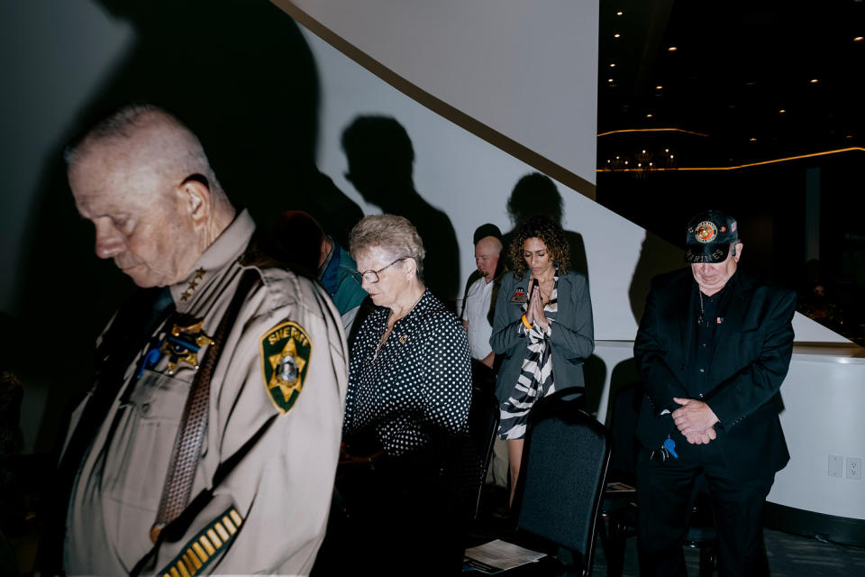 Songer prays with conference goers.  (Mark Abramson for NBC News)