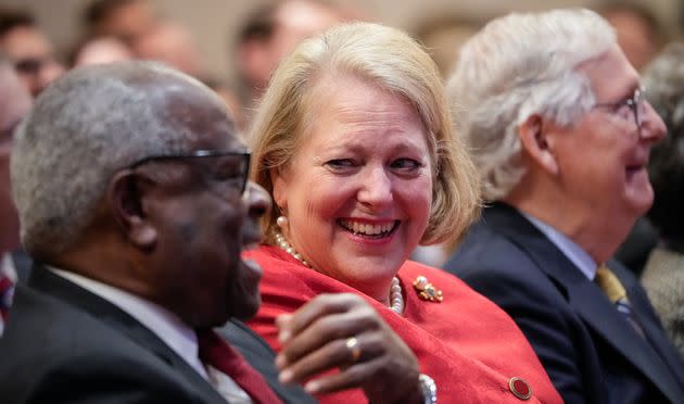 Supreme Court Justice Clarence Thomas shares a laugh with his wife, conservative activist Virginia Thomas, while he waits to speak at the Heritage Foundation last year in Washington, D.C.  (Photo: Drew Angerer via Getty Images)