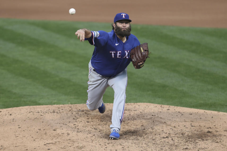 Texas Rangers pitcher Lance Lynn throws against the Oakland Athletics during the fifth inning of a baseball game in Oakland, Calif., Tuesday, Aug. 4, 2020. (AP Photo/Jed Jacobsohn)