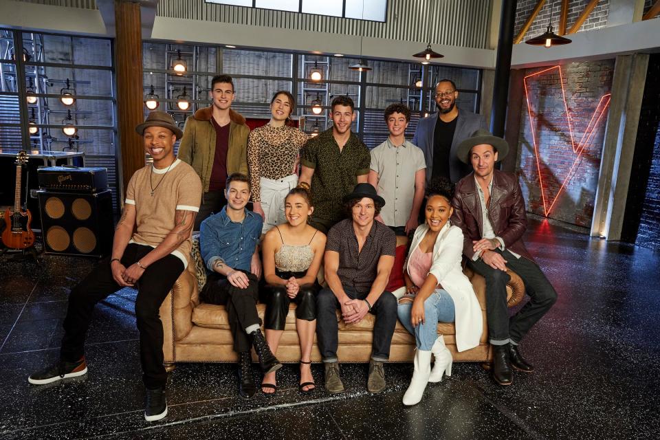 Back from left: Michael Williams, Joana Serenko, Nick Jonas, Tate Brusa and Roderick Chambers; front from left: Samuel Wilco, Jacob Miller, Allegra Miles, Kevin Farris, Arei Moon, and Anders Derup. From season 18 of "The Voice."