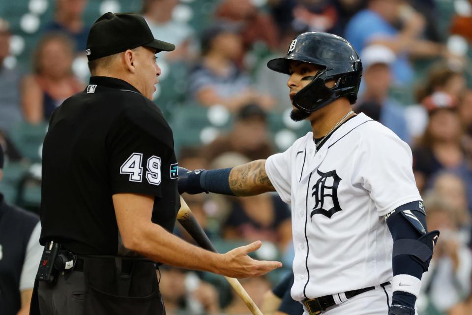 Tigers shortstop Javier Baez talks to umpire Andy Fletcher after striking out in the third inning against the Guardians on Tuesday, Aug. 9, 2022, at Comerica Park.