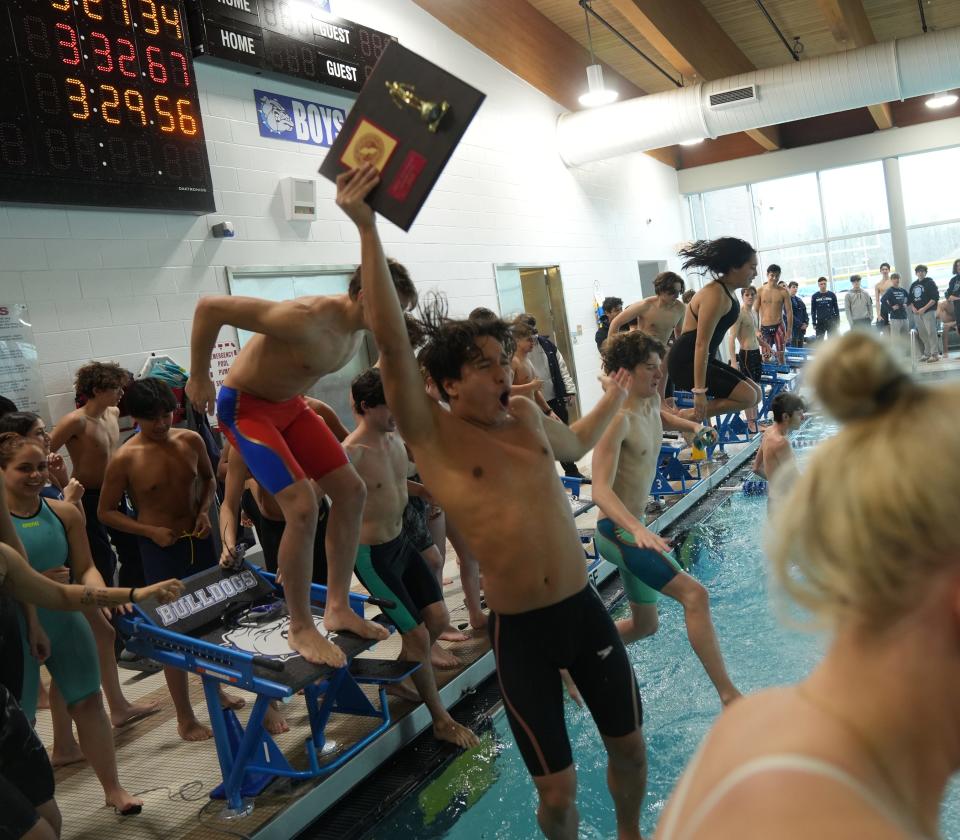 The Passaic swim team celebrates winning the Passaic County Swimming Championships held at the Passaic Technical Institute in Wayne, NJ on January  21, 2023.