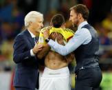 <p>England manager Gareth Southgate and Colombia coach Jose Pekerman console Mateus Uribe after the penalty shootout. REUTERS/Carl Recine </p>