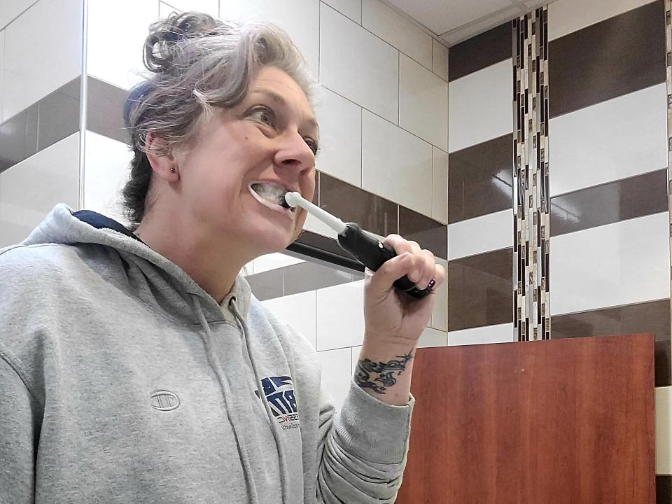 carla brushes her teeth