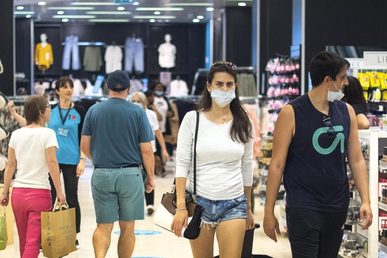 Customers wear face masks as they shop at Primark in Oxford Street, London: PA