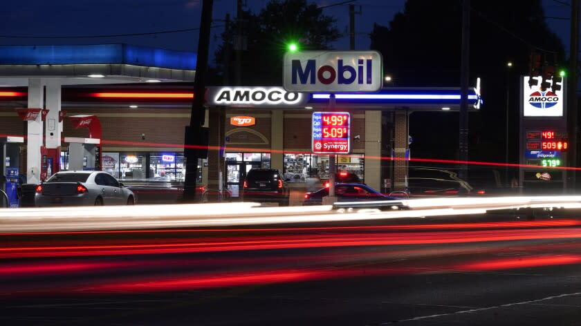 Motorists stop for fuel at gas stations in Detroit, Tuesday, July 5, 2022. As Congress and now the Supreme Court stymie the Biden administration's efforts to curb climate change, one thing the president doesn't want - sky high gas prices - actually is nibbling away at emissions of heat-trapping gas. (AP Photo/Paul Sancya)