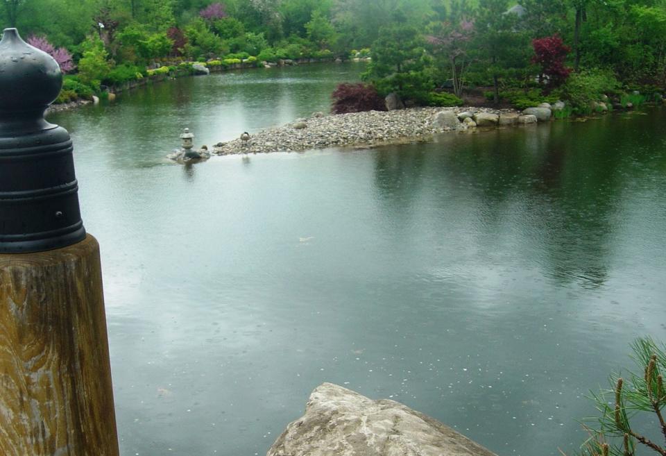 Japanese maples and redbuds punctuate a lakeside setting at the DeVos Japanese Garden at Frederik Meijer Gardens &amp; Sculpture Park, outside Grand Rapids, Mich.