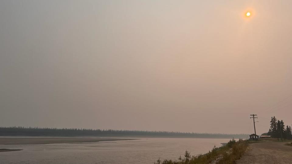 A smoky haze hangs over Old Crow, Yukon, on Wednesday. Residents report that the smoke has been so thick at times that they can't see across the river.