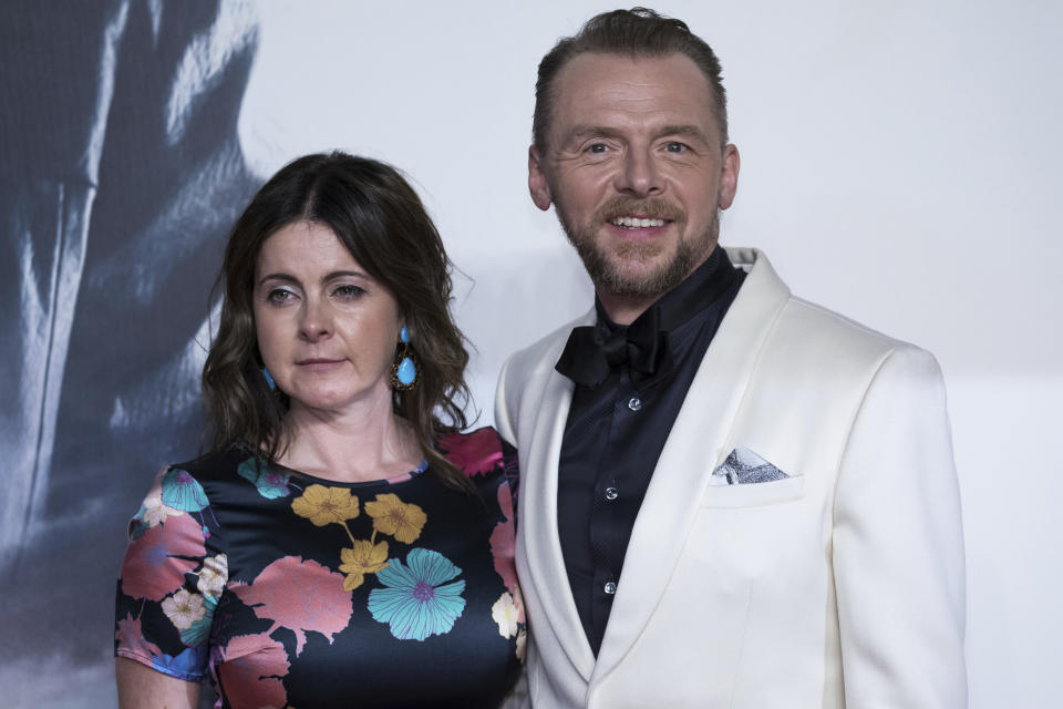 Actor Simon Pegg, right, and his wife Maureen Pegg pose for photographers upon arrival at the premiere of the film 'Mission Impossible Fallout', in London, Friday, July 13, 2018. (Photo by Vianney Le Caer/Invision/AP)