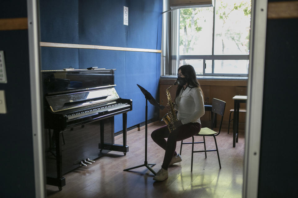 Acid attack survivor Maria Elena Ríos is reflected in a mirror while playing her saxophone during a rehearsal at the National Autonomous University of Mexico music department, in Mexico City, Tuesday, Feb. 14, 2023. "We are reconciling, little by little," says Ríos about her instrument. "I hated it, because I thought it was responsible" for the 2019 acid attack. Ríos thought her career as a musician and her devotion to hersaxwas what ledherformer boyfriend and politician to hire the men who splashed acid into her faceand body, disfiguring her. (AP Photo/Ginnette Riquelme)