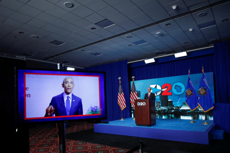 A screen plays a video of former president Barack Obama as Chairman of the Democratic National Committee Tom Perez waits to speak during the virtual Democratic National Convention in Milwaukee, Wisconsin, August 20, 2020.   Kamil Krzaczynski/Pool via REUTERS