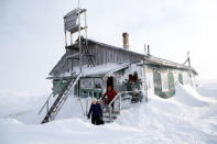 Local electoral commission members leave a weather station during the early voting in remote areas ahead of the presidential election, in the settlement of Cape Konstantinovsky, about 250 km north of Naryan-Mar, in Nenets Autonomous District, Russia, March 8, 2018. REUTERS/Sergei Karpukhin