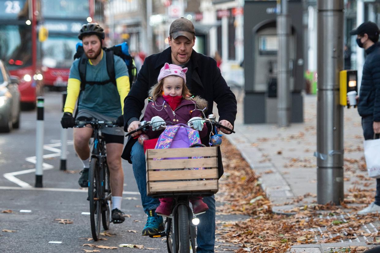 <p>About 100 cyclists covered in tinsel rode along Kensington High Street this morning</p> (Daniel Hambury/Stella Pictures Ltd)