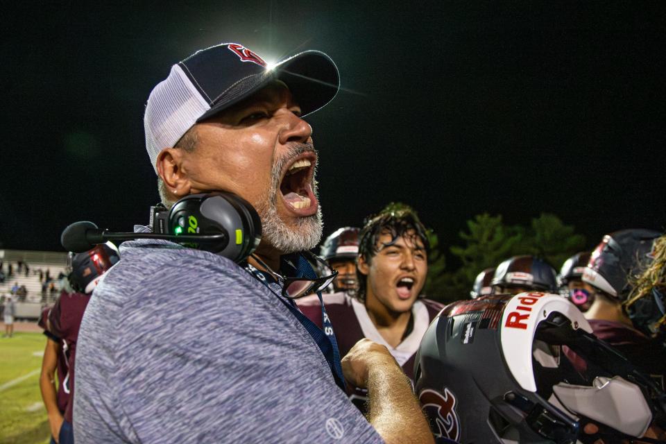 Head Coach Juan Ruiz of La Quinta High School shouts with excitement after their victory 20-13 over Xavier Prep in La Quinta, California, on October 13, 2023.
