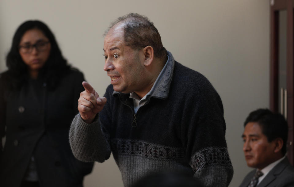 Former government Minister Carlos Romero speaks during his court hearing where a judge ordered he remain in custody at the Supreme Court in La Paz, Bolivia, Thursday, Jan. 16, 2020. Romero, a former minister of ex-president Evo Morales' government, was detained earlier this week for alleged corruption. (AP Photo/Juan Karita)