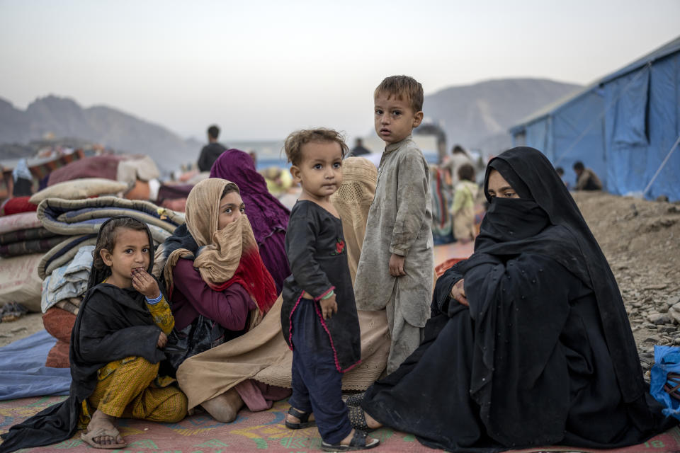 Afghan refugees settle in a camp near the Torkham Pakistan-Afghanistan border in Torkham, Afghanistan, Saturday, Nov. 4, 2023. A huge number of Afghans refugees entered the Torkham border to return home hours before the expiration of a Pakistani government deadline for those who are in the country illegally to leave or face deportation. (AP Photo/Ebrahim Noroozi)