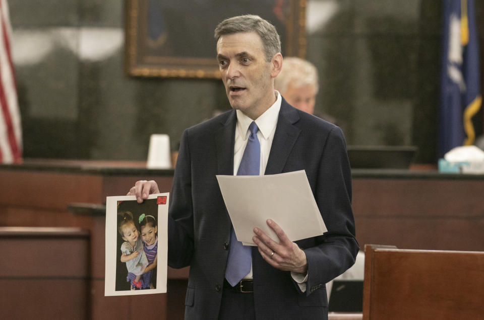 11th Circuit Solicitor Rick Hubbard delivers closing arguments, showing pictures of the Jones children during the sentencing phase of the trial of Timothy Jones Jr. in Lexington, S.C. on Thursday, June 13, 2019. Jones, Jr. was found guilty of killing his five young children in 2014. (Tracy Glantz/The State via AP, Pool)