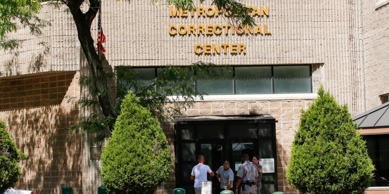 FILE PHOTO: Security personnel and people are seen at the entrance of the Metropolitan Correctional Center jail where financier Jeffrey Epstein was found dead in the Manhattan borough of New York City, New York, U.S., August 12, 2019. REUTERS/Eduardo Munoz/File Photo