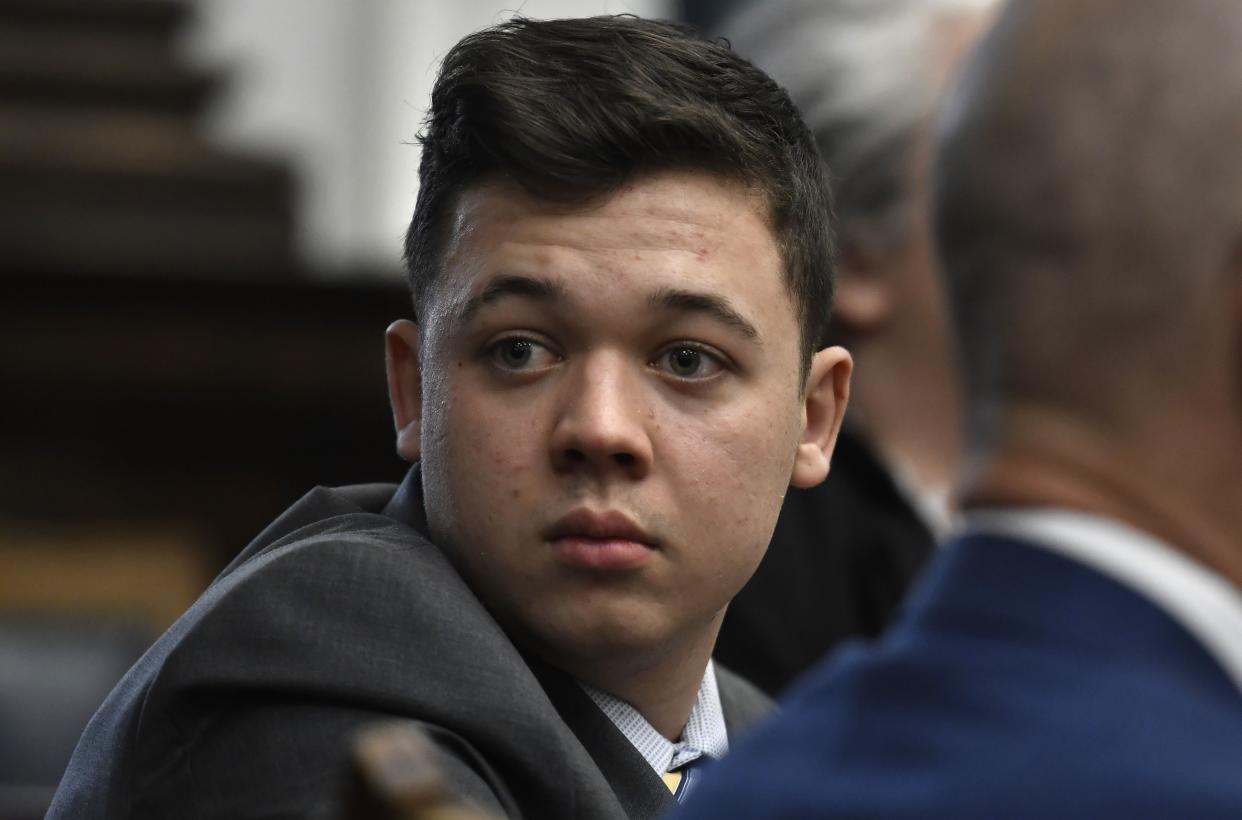 Kyle Rittenhouse looks back as attorneys discuss items in the motion for mistrial presented by his defense during his trial at the Kenosha County Courthouse on November 17, 2021 in Kenosha, Wisconsin.