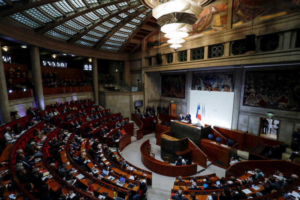 French Prime Minister Edouard Philippe delivers his speech Wednesday, Dec. 11, 2019 at the Economic, Social and Environmental Council in Paris as he unveils proposals on pension reforms that might calm tensions on the seventh straight day of a crippling transport strike. (Thomas Samson/Pool via AP)